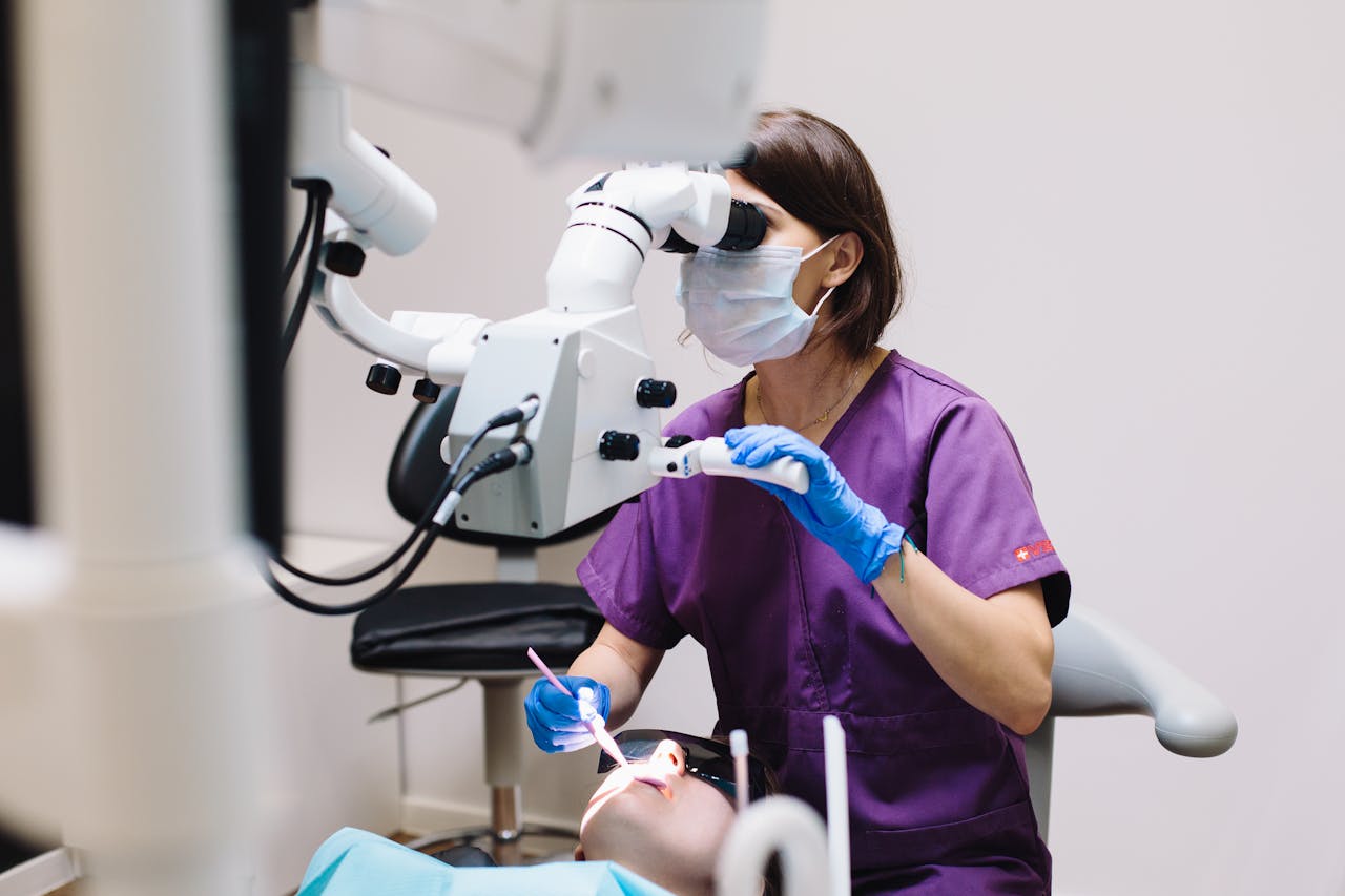 Mastering the First Impression: Your intriguing post title goes here Female dentist using a microscope and modern technology during a patient examination in a dental clinic.